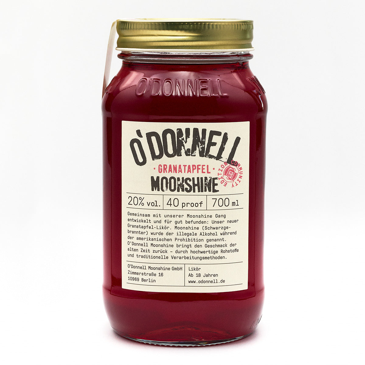 O'Donnell Granatapfel Moonshine-Glas auf weißem Hintergrund