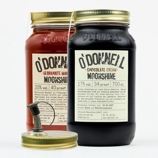 Abgebildet sind zwei O'Donnell Moonshine 700ml Jars, gebrannte Mandel und Chocolate Cream.