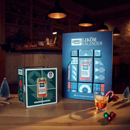 O'Donnell Moonshine DAS Adventskalender Bundle passende präsentiert auf einem dekorierten Tisch.