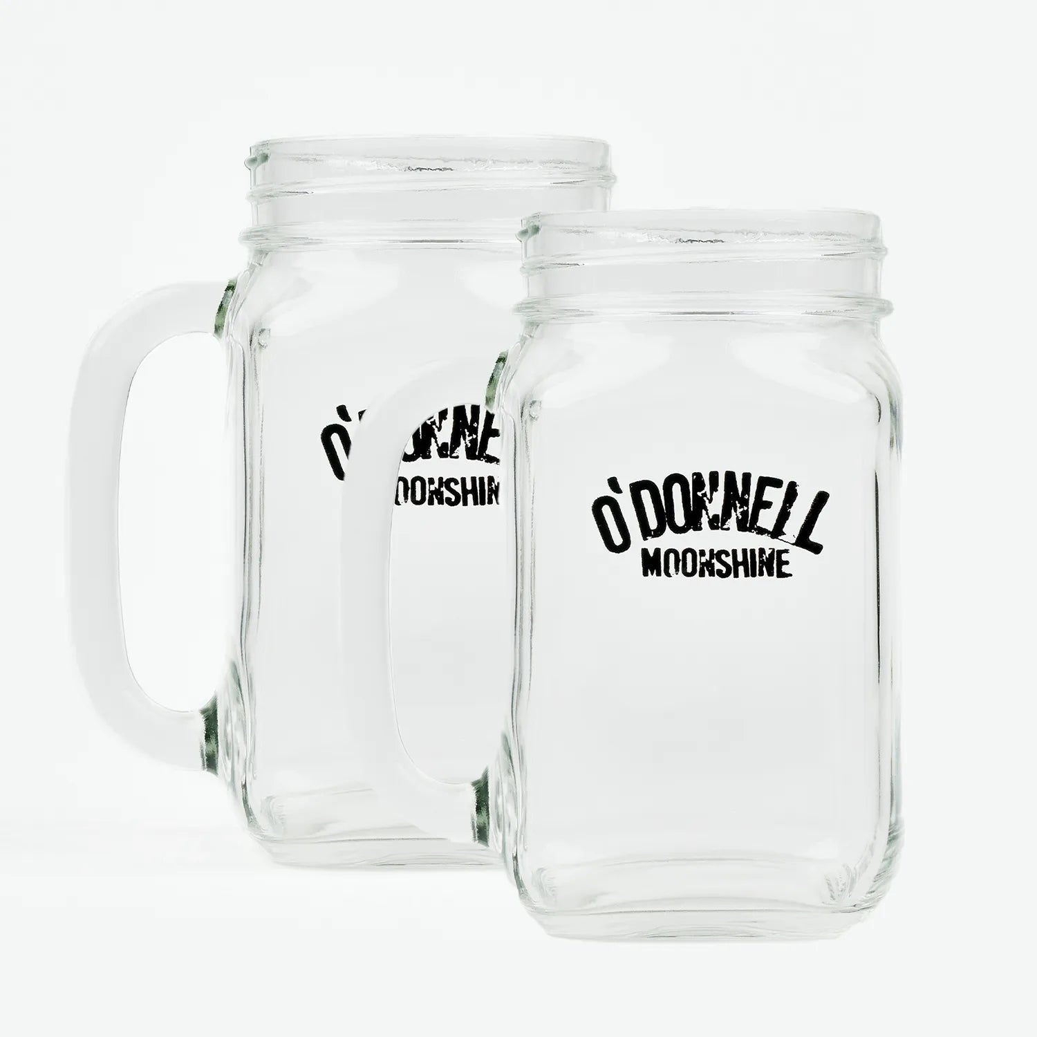 Zwei O'Donnell Moonshine Henkelgläser nebeneinander, freigestellt auf weißem Hintergrund – transparentes Glas mit schwarzem Logo-Aufdruck