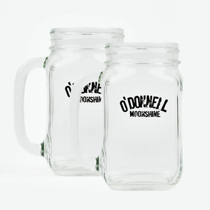 Zwei O'Donnell Moonshine Henkelgläser nebeneinander, freigestellt auf weißem Hintergrund – transparentes Glas mit schwarzem Logo-Aufdruck