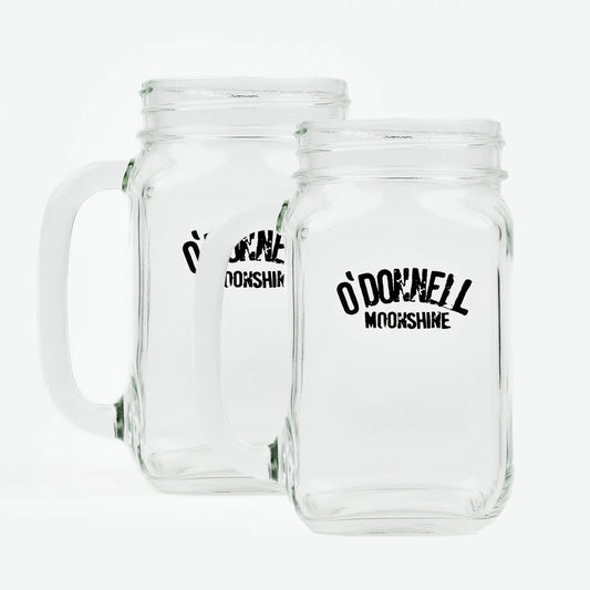 Zwei O'Donnell Moonshine Henkelgläser nebeneinander, freigestellt auf weißem Hintergrund – transparentes Glas mit schwarzem Logo-Aufdruck