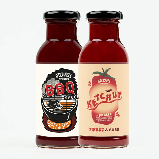 O'Donnell Moonshine BBQ Sauce und BBQ Ketchup Flaschen nebeneinander – Sweet & Spicy und Pikant & Süss, freigestellt auf weißem Hintergrund